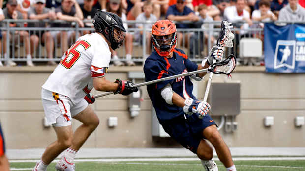 Connor Shellenberger dodges against Ajax Zappitello during the Virginia men's lacrosse game against Maryland in the quarterfinals of the 2022 NCAA Men's Lacrosse Tournament at Ohio Stadium.